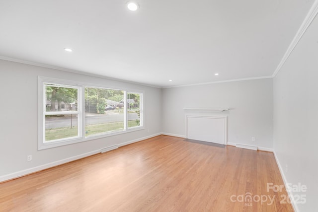 2001 Tyvola Rd, Charlotte, NC 28210 - unfurnished living room featuring ornamental molding, light wood-style floors, baseboards, and recessed lighting