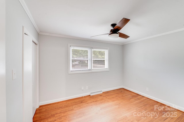 2001 Tyvola Rd, Charlotte, NC 28210 - unfurnished bedroom with ornamental molding, light wood-style flooring, baseboards, and a ceiling fan