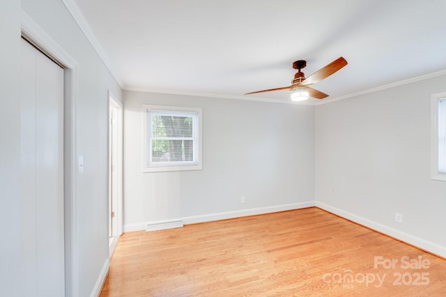 2001 Tyvola Rd, Charlotte, NC 28210 - unfurnished bedroom featuring light wood finished floors, ornamental molding, baseboards, ceiling fan, and a closet
