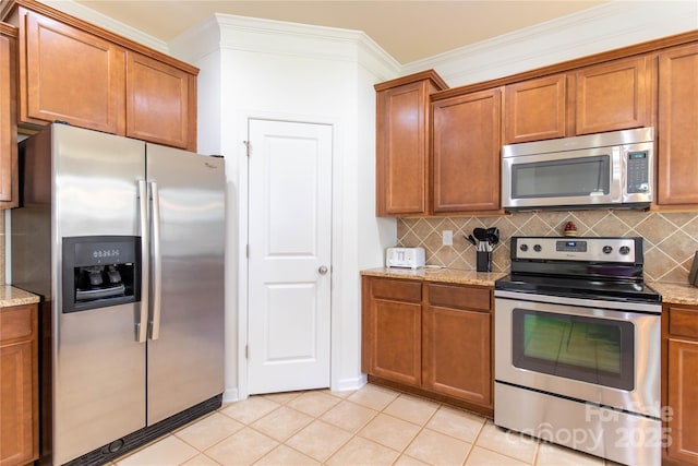 159 Saye Pl, Mooresville, NC 28115 - kitchen featuring stainless steel appliances, brown cabinetry, and ornamental molding