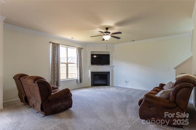 159 Saye Pl, Mooresville, NC 28115 - living room featuring light colored carpet, a glass covered fireplace, a ceiling fan, and crown molding