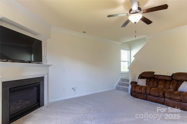 159 Saye Pl, Mooresville, NC 28115 - living area with crown molding, stairway, carpet floors, a ceiling fan, and a glass covered fireplace