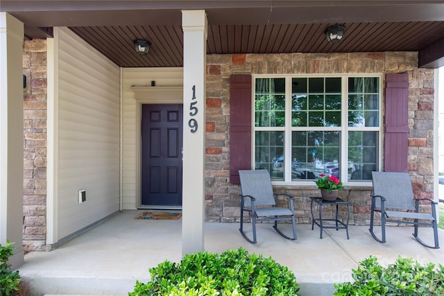 159 Saye Pl, Mooresville, NC 28115 - property entrance featuring a porch and stone siding