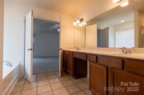 159 Saye Pl, Mooresville, NC 28115 - bathroom with double vanity, tile patterned flooring, a garden tub, and ceiling fan
