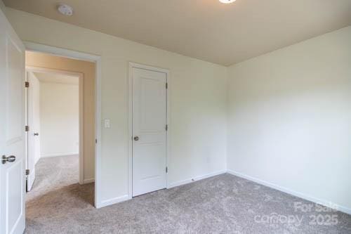 159 Saye Pl, Mooresville, NC 28115 - unfurnished bedroom with carpet floors and baseboards