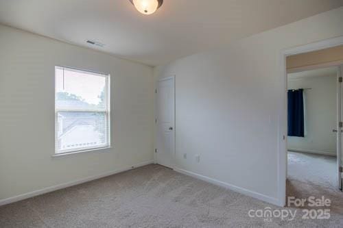 159 Saye Pl, Mooresville, NC 28115 - carpeted spare room featuring baseboards