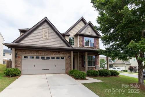 159 Saye Pl, Mooresville, NC 28115 - craftsman-style house featuring driveway, a garage, and a front lawn