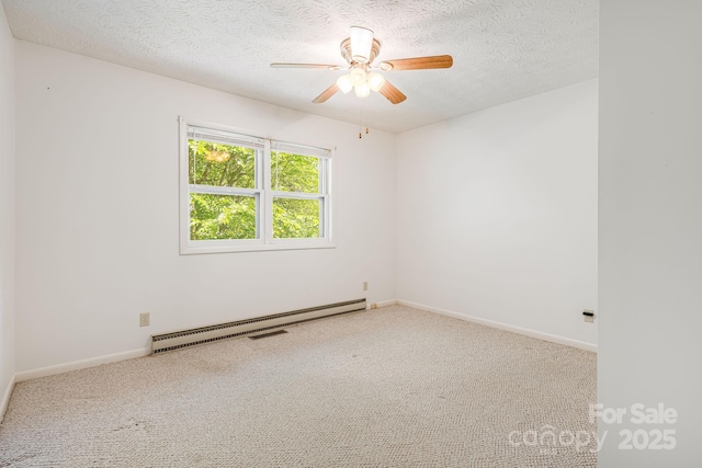 3127 Butler Bridge Rd, Mills River, NC 28759 - carpeted spare room with baseboard heating, a textured ceiling, a ceiling fan, and baseboards