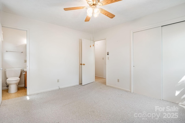 3127 Butler Bridge Rd, Mills River, NC 28759 - unfurnished bedroom with carpet, a closet, ensuite bath, ceiling fan, and baseboards