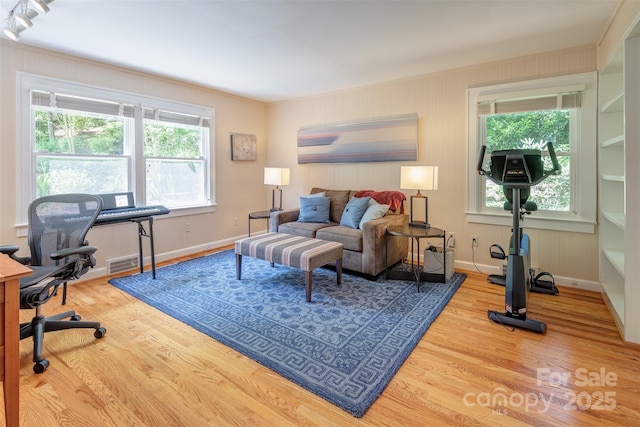 47 Lakeview Rd, Asheville, NC 28804 - living area featuring wood finished floors, a desk, healthy amount of natural light, and baseboards