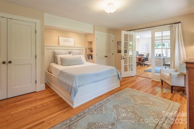 47 Lakeview Rd, Asheville, NC 28804 - bedroom featuring french doors, light wood-style flooring, and a desk