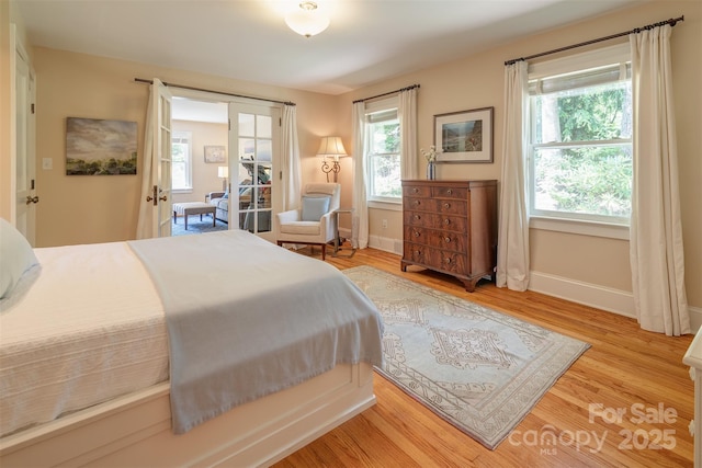 47 Lakeview Rd, Asheville, NC 28804 - bedroom with multiple windows, wood finished floors, and baseboards