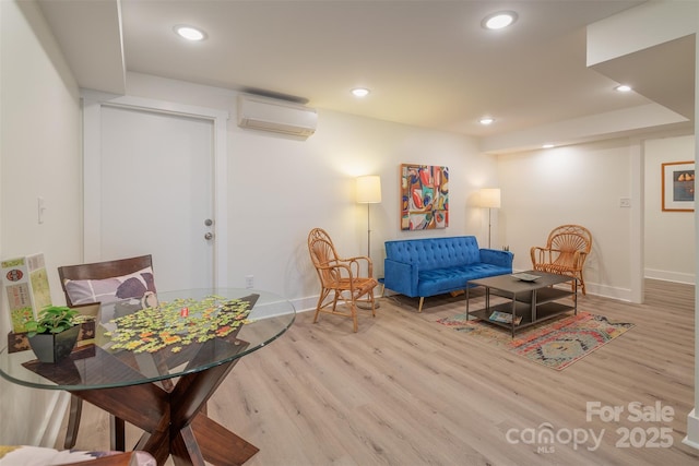 47 Lakeview Rd, Asheville, NC 28804 - sitting room featuring an AC wall unit, wood finished floors, baseboards, and recessed lighting
