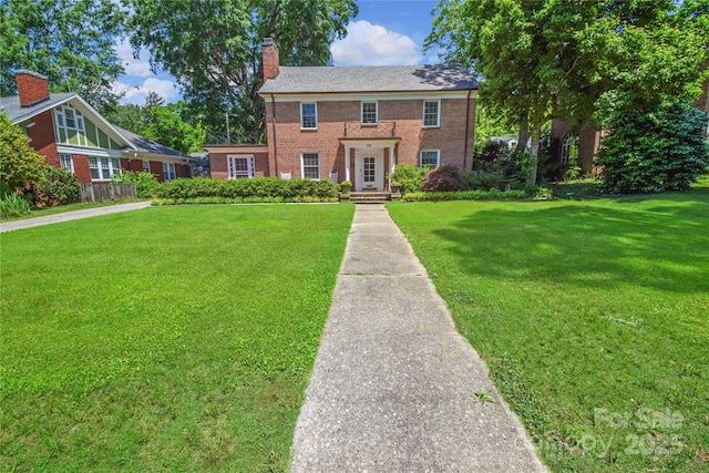 1101 Pee Dee Ave, Albemarle, NC 28001 - view of front of property with a front lawn, brick siding, and a chimney