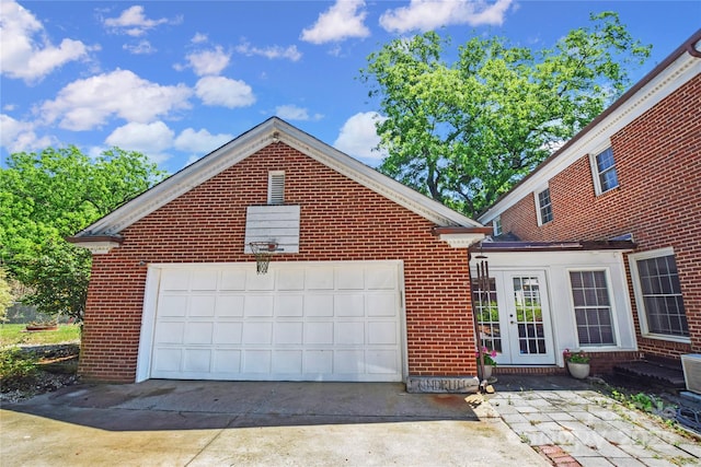 1101 Pee Dee Ave, Albemarle, NC 28001 - view of front of property with brick siding, a garage, driveway, and french doors