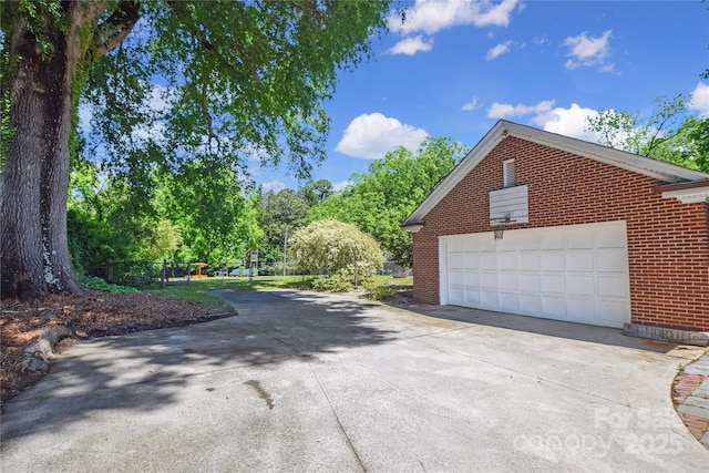 1101 Pee Dee Ave, Albemarle, NC 28001 - view of side of property with brick siding and view of wooded area