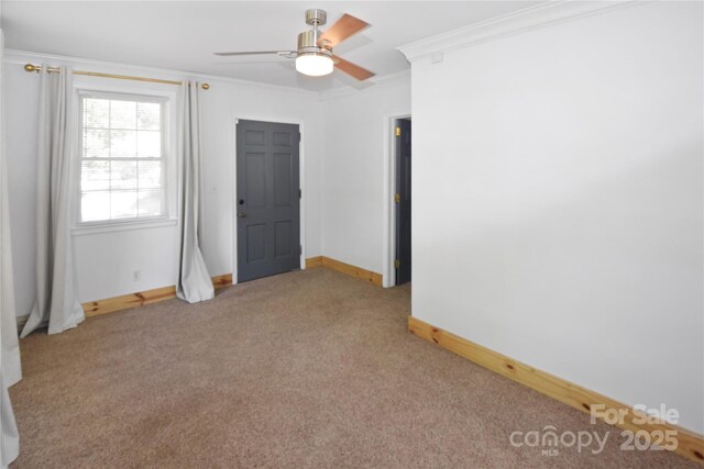 1101 Pee Dee Ave, Albemarle, NC 28001 - carpeted empty room featuring ornamental molding, baseboards, and a ceiling fan