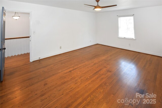 1101 Pee Dee Ave, Albemarle, NC 28001 - empty room with a ceiling fan, wood finished floors, and baseboards