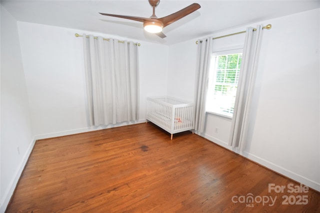 1101 Pee Dee Ave, Albemarle, NC 28001 - empty room featuring wood finished floors, ceiling fan, and baseboards