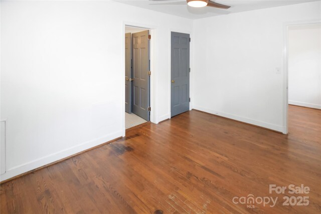 1101 Pee Dee Ave, Albemarle, NC 28001 - spare room with a ceiling fan, baseboards, and wood finished floors
