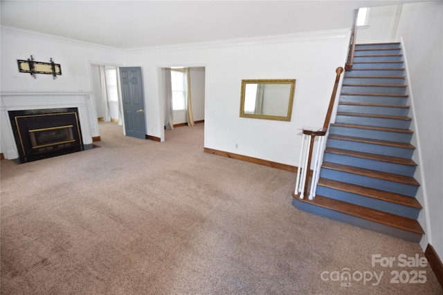 1101 Pee Dee Ave, Albemarle, NC 28001 - unfurnished living room featuring ornamental molding, stairway, carpet, baseboards, and a fireplace with flush hearth