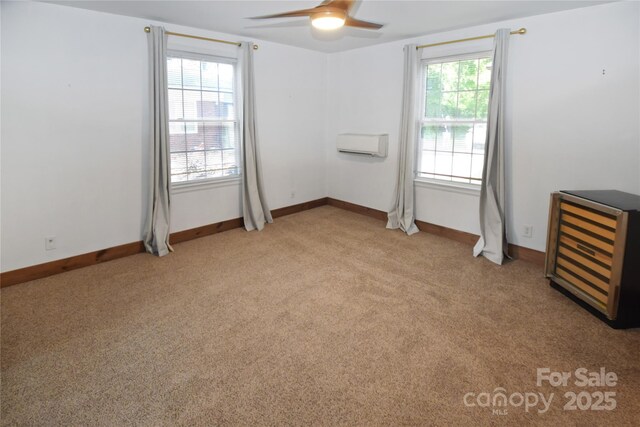 1101 Pee Dee Ave, Albemarle, NC 28001 - spare room with ceiling fan, healthy amount of natural light, light colored carpet, and an AC wall unit