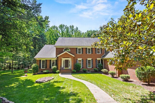 7103 Forest Ridge Rd, Matthews, NC 28104 - colonial inspired home featuring brick siding and a front yard