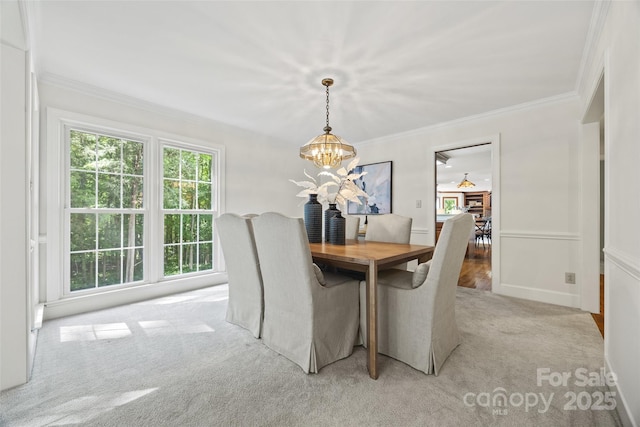 7103 Forest Ridge Rd, Matthews, NC 28104 - dining room featuring a chandelier, light colored carpet, plenty of natural light, and ornamental molding