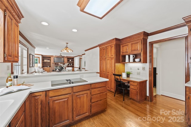 7103 Forest Ridge Rd, Matthews, NC 28104 - kitchen featuring a peninsula, light countertops, crown molding, brown cabinetry, and backsplash