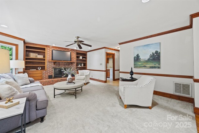 7103 Forest Ridge Rd, Matthews, NC 28104 - living room featuring built in features, baseboards, ceiling fan, a brick fireplace, and ornamental molding