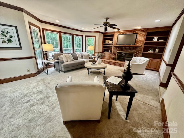 7103 Forest Ridge Rd, Matthews, NC 28104 - living area featuring light carpet, ceiling fan, ornamental molding, built in shelves, and baseboards