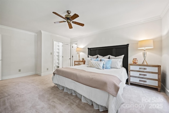 7103 Forest Ridge Rd, Matthews, NC 28104 - carpeted bedroom with ornamental molding, baseboards, ceiling fan, and a walk in closet