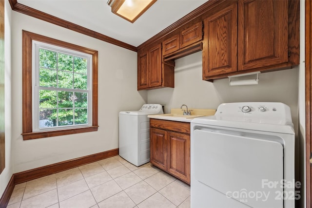 7103 Forest Ridge Rd, Matthews, NC 28104 - clothes washing area with cabinet space, healthy amount of natural light, baseboards, crown molding, and separate washer and dryer