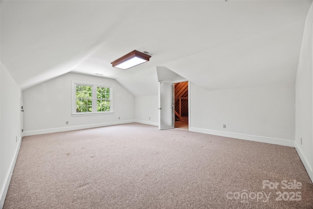 7103 Forest Ridge Rd, Matthews, NC 28104 - additional living space featuring light carpet, lofted ceiling, and baseboards
