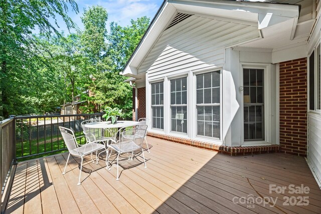 7103 Forest Ridge Rd, Matthews, NC 28104 - wooden deck featuring outdoor dining space