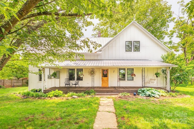 564 Jupiter Rd, Weaverville, NC 28787 - view of front of property featuring board and batten siding, covered porch, and metal roof