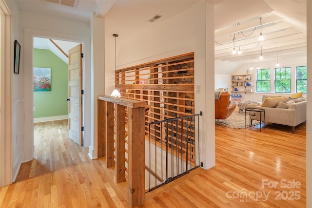 564 Jupiter Rd, Weaverville, NC 28787 - wine area featuring vaulted ceiling, light wood finished floors, and baseboards