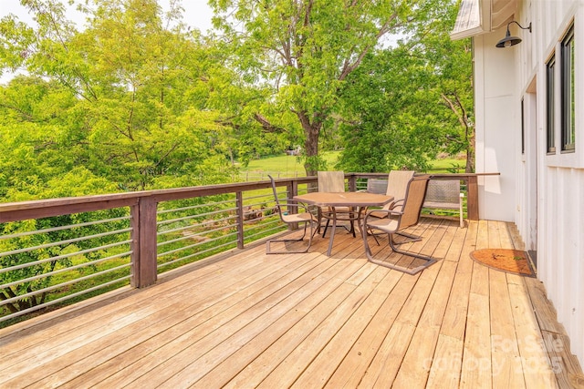 564 Jupiter Rd, Weaverville, NC 28787 - wooden deck with outdoor dining area and view of scattered trees