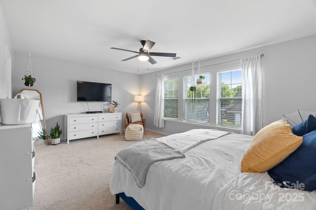 bedroom with carpet, baseboards, and a ceiling fan