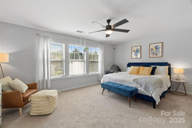 carpeted bedroom with baseboards and a ceiling fan