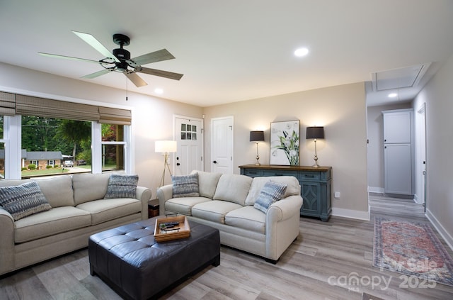 living area with recessed lighting, attic access, baseboards, light wood finished floors, and ceiling fan