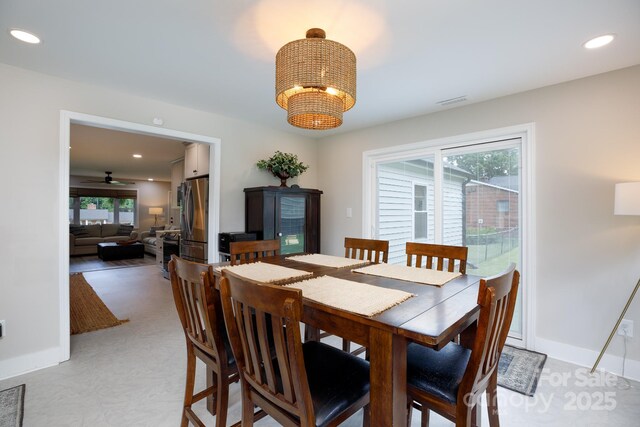 dining room with visible vents, baseboards, ceiling fan with notable chandelier, and recessed lighting
