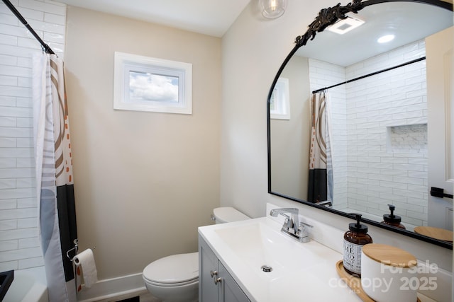 full bathroom with toilet and vanity