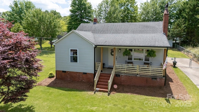 bungalow featuring covered porch, crawl space, a chimney, and a front yard