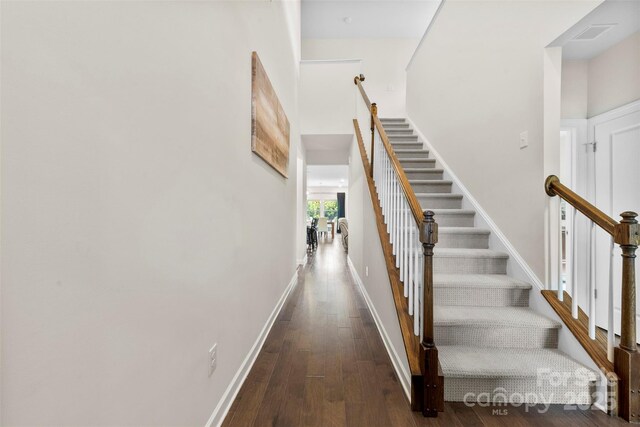 5727 Lavaux Ct, Charlotte, NC 28214 - stairs with hardwood / wood-style floors, baseboards, and a high ceiling