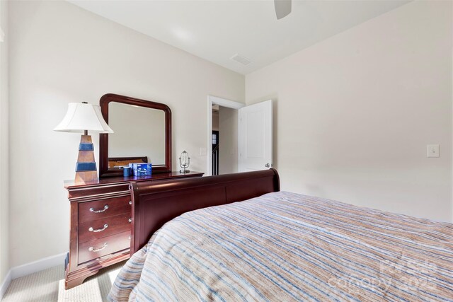 5727 Lavaux Ct, Charlotte, NC 28214 - bedroom with baseboards, carpet floors, and ceiling fan