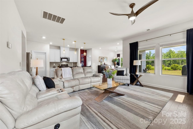 5727 Lavaux Ct, Charlotte, NC 28214 - living room featuring a ceiling fan, wood finished floors, and recessed lighting