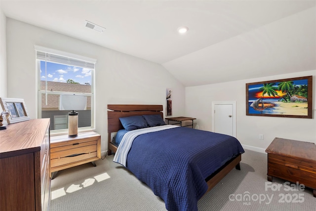 5727 Lavaux Ct, Charlotte, NC 28214 - bedroom featuring light carpet, lofted ceiling, and baseboards