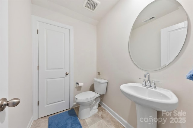 5727 Lavaux Ct, Charlotte, NC 28214 - half bathroom featuring baseboards and toilet