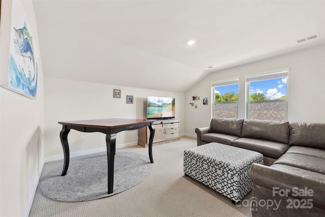 5727 Lavaux Ct, Charlotte, NC 28214 - carpeted living room with vaulted ceiling and baseboards